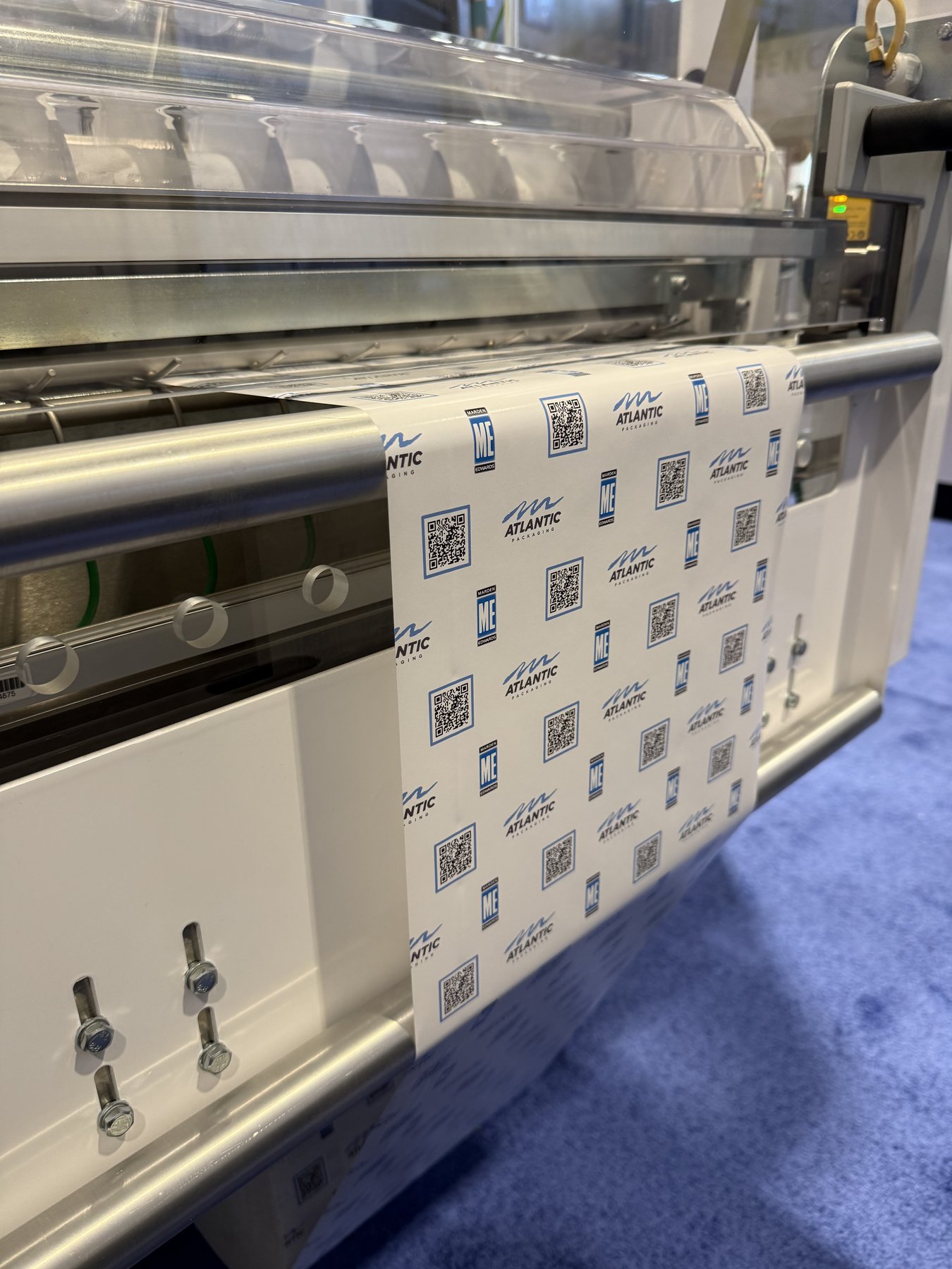 Atlantic-printed paper feeding through a Marden Edwards tuck-and-fold overwrapper